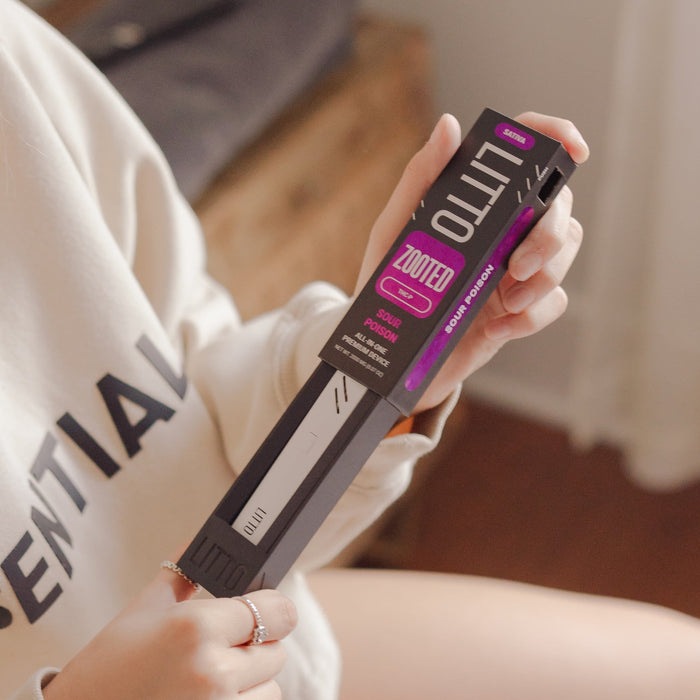 Woman holding a LITTO Zooted Disposable